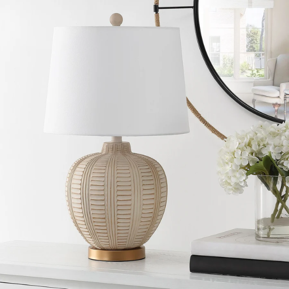 Cream and rose gold resin table lamp with carved textured base, white cotton drum shade, and built-in USB charging port for modern boho interiors