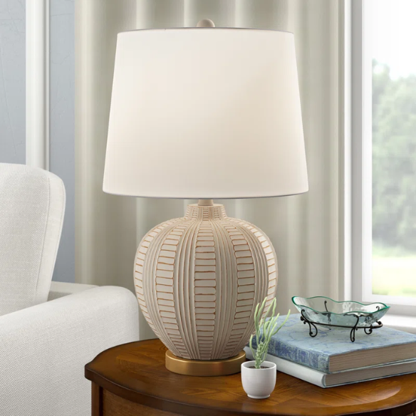 Cream and rose gold resin table lamp with carved textured base, white cotton drum shade, and built-in USB charging port for modern boho interiors