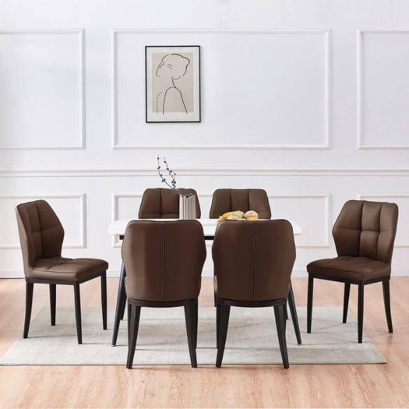 Set of two brown mid-century modern faux leather dining chairs with checkered stitching and metal legs