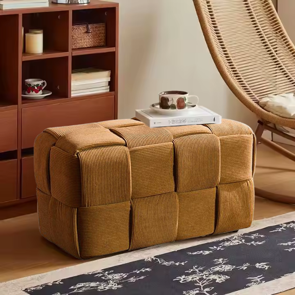 Burnt orange velvet ottoman with engineered wood frame, modern design, and square woven shape