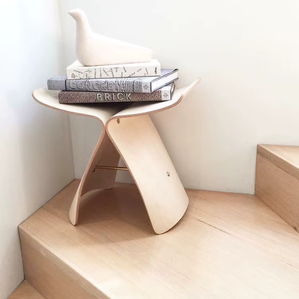 Butterfly design bar stool in log tan solid wood with eco-friendly materials and a durable metal frame.