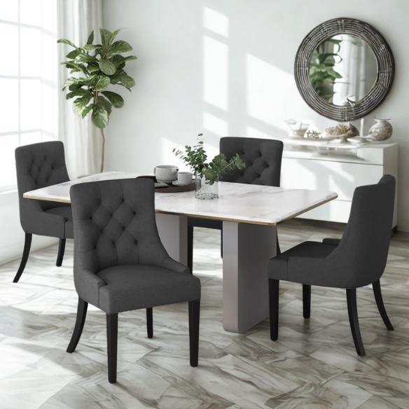 Set of four dark charcoal grey upholstered dining chairs featuring diamond tufted backs, armless design, sloped sides, and espresso wood legs.