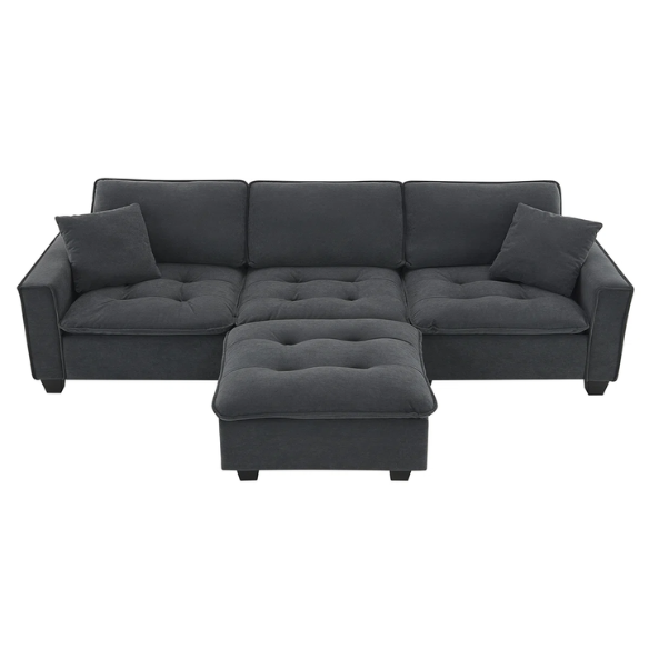 Charcoal grey suede L-shaped sectional sofa with tufted cushions, reversible chaise, removable ottoman, and two matching throw pillows