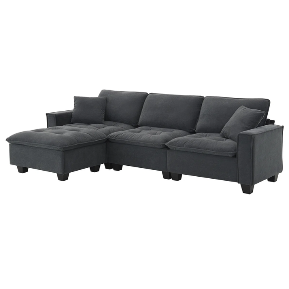 Charcoal grey suede L-shaped sectional sofa with tufted cushions, reversible chaise, removable ottoman, and two matching throw pillows