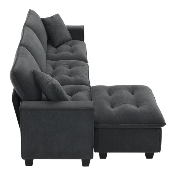 Charcoal grey suede L-shaped sectional sofa with tufted cushions, reversible chaise, removable ottoman, and two matching throw pillows
