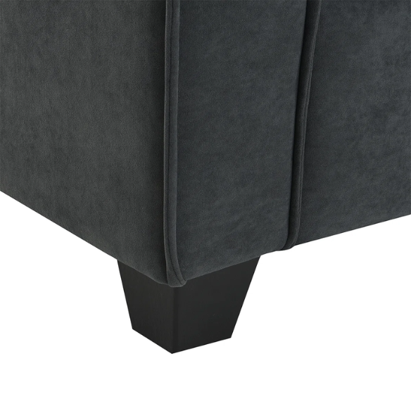 Charcoal grey suede L-shaped sectional sofa with tufted cushions, reversible chaise, removable ottoman, and two matching throw pillows