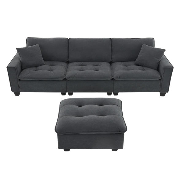 Charcoal grey suede L-shaped sectional sofa with tufted cushions, reversible chaise, removable ottoman, and two matching throw pillows