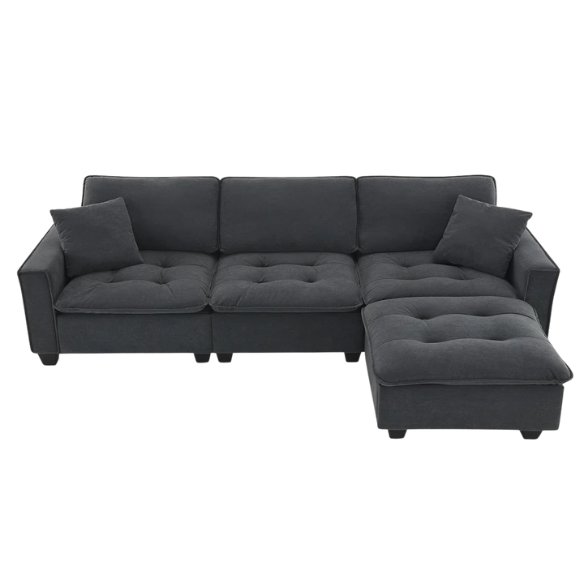 Charcoal grey suede L-shaped sectional sofa with tufted cushions, reversible chaise, removable ottoman, and two matching throw pillows