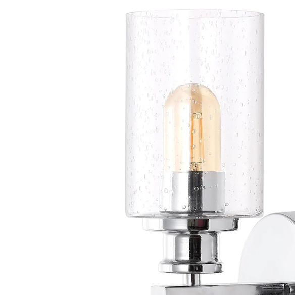 Polished chrome wall sconce with dual clear seeded glass cylinder shades and Edison-style LED bulbs, ideal for modern bathrooms or entryways