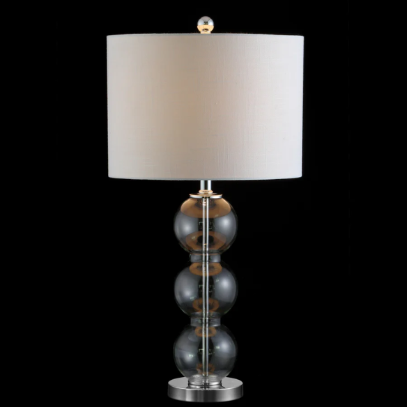 Set of 2 clear glass table lamps with triple-sphere design, polished silver accents, and white linen drum shades – elegant lighting for bedroom, living room, or office