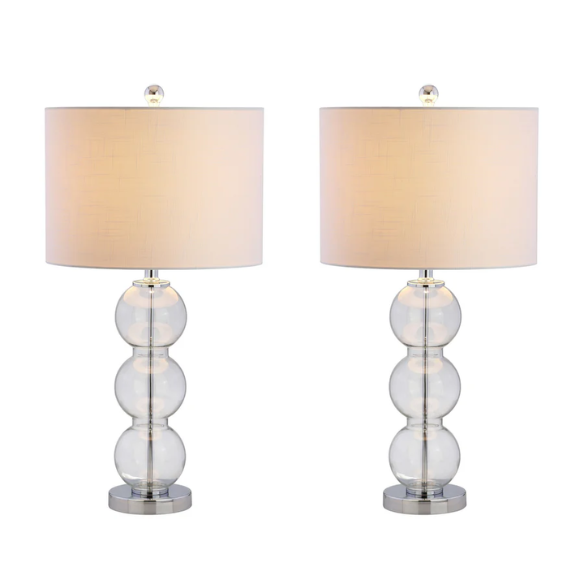 Set of 2 clear glass table lamps with triple-sphere design, polished silver accents, and white linen drum shades – elegant lighting for bedroom, living room, or office