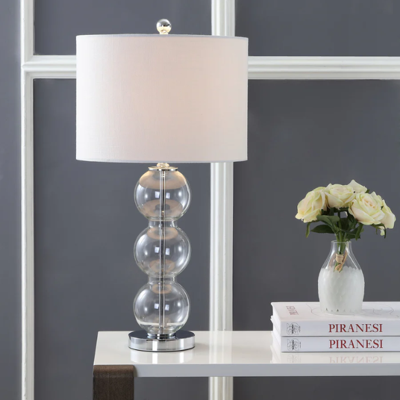 Set of 2 clear glass table lamps with triple-sphere design, polished silver accents, and white linen drum shades – elegant lighting for bedroom, living room, or office