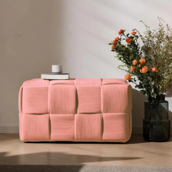 Blush velvet ottoman with modern cube design and durable wood frame.