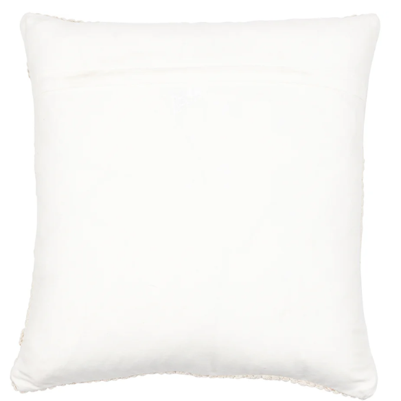 Cream handwoven boho throw pillow with chevron texture on a modern neutral-toned sofa