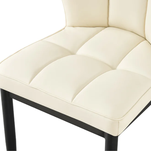 Set of two cream mid-century modern faux leather dining chairs with checkered stitching and metal legs