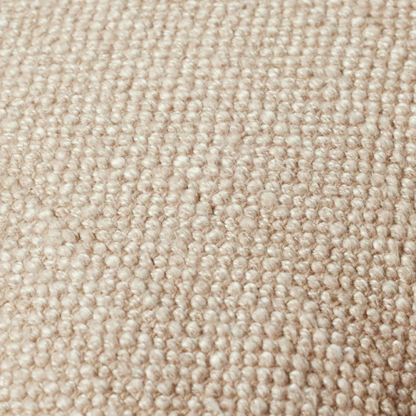Cream cotton blend throw pillow with fringe, 22x22 square cushion, styled on a modern sofa for soft, neutral home decor.