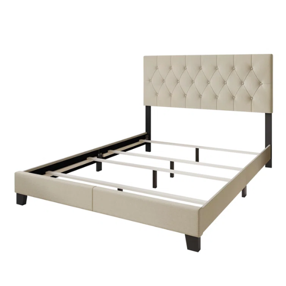 Cream linen full size upholstered bed with button tufted headboard and low-profile legs