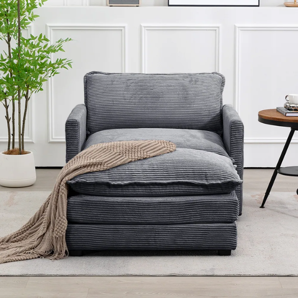 Dark grey corduroy accent chair with matching ottoman, featuring soft high-pile fabric, high-resilience foam cushions, and a sturdy metal and wood frame.