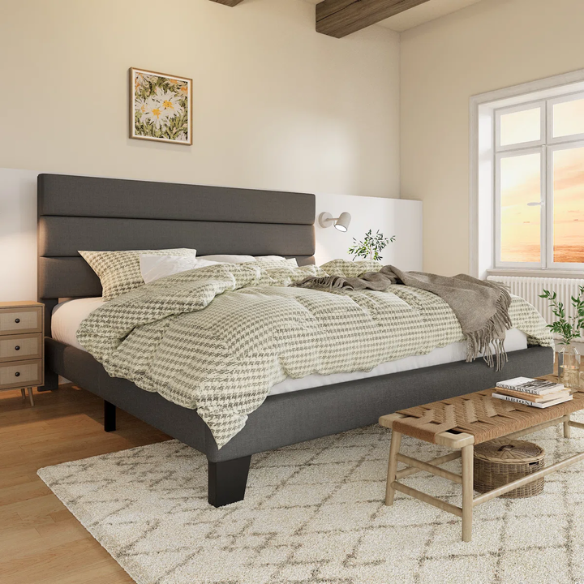 Dark grey king-size upholstered platform bed with padded headboard, slat support system, and no box spring needed