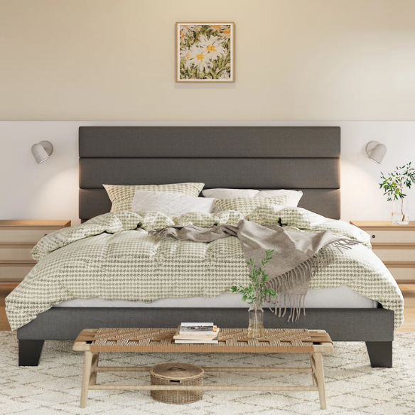 Dark grey king-size upholstered platform bed with padded headboard, slat support system, and no box spring needed