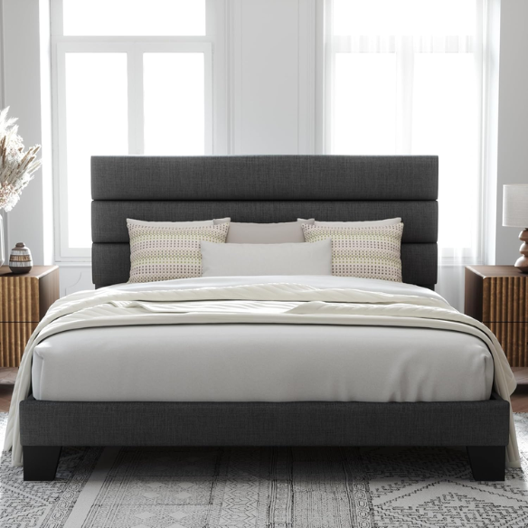 Dark grey king-size upholstered platform bed with padded headboard, slat support system, and no box spring needed
