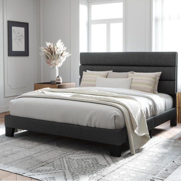 Dark grey king-size upholstered platform bed with padded headboard, slat support system, and no box spring needed