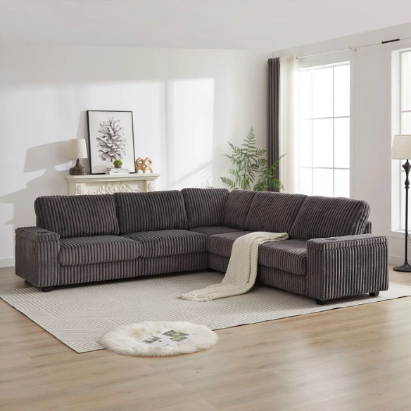 Dark grey modular corduroy sectional sofa with five seats, built-in USB ports, armrest storage, cup holders, and throw pillows
