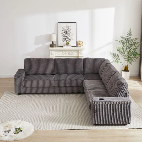 Dark grey modular corduroy sectional sofa with five seats, built-in USB ports, armrest storage, cup holders, and throw pillows
