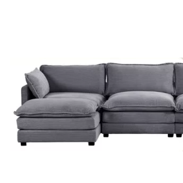Dark grey 4-seat modular sectional sofa with two matching ottomans, upholstered in soft corduroy with high-resilience cushions and a sturdy wood and metal frame.
