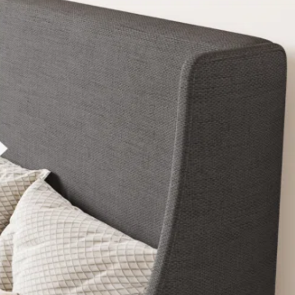 Dark grey upholstered queen platform bed with wingback headboard, slatted base, and black tapered legs – no box spring required