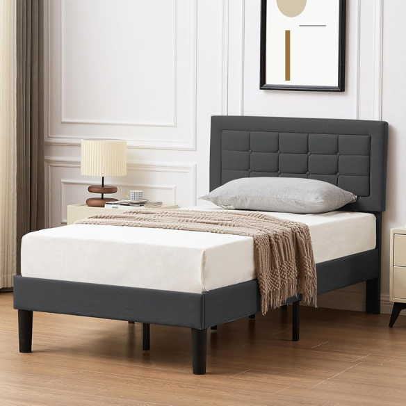 Dark grey twin-size upholstered platform bed with button-tufted adjustable headboard, wooden slats, steel center support, and underbed storage clearance.