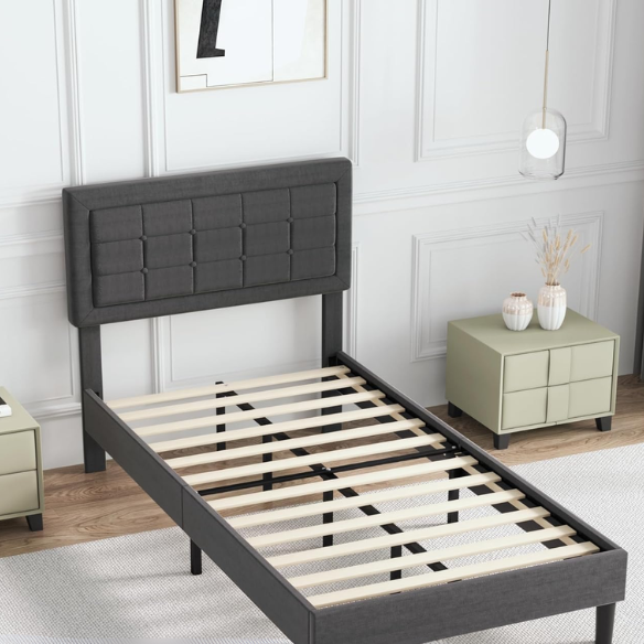 Dark grey twin-size upholstered platform bed with button-tufted adjustable headboard, wooden slats, steel center support, and underbed storage clearance.