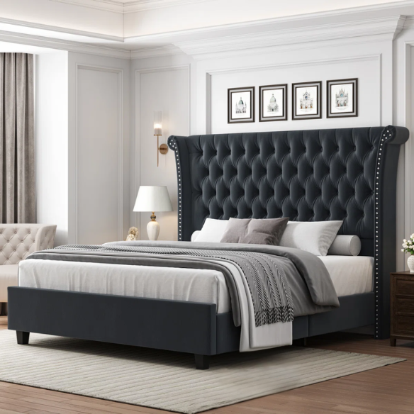 Dark grey velvet king-size platform bed with tall tufted wingback headboard, nailhead trim, and no box spring required