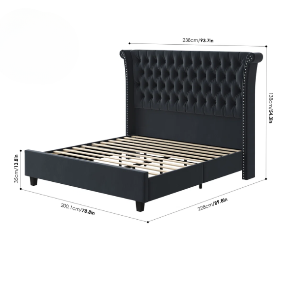 Dark grey velvet king-size platform bed with tall tufted wingback headboard, nailhead trim, and no box spring required
