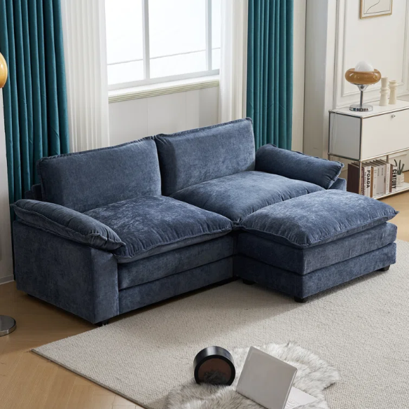 Deep blue chenille modular cloud sofa with plush foam cushions, pillow top arms, and a matching ottoman