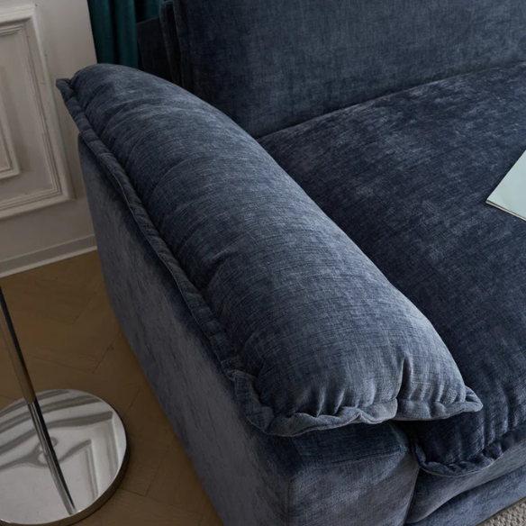 Deep blue chenille modular cloud sofa with plush foam cushions, pillow top arms, and a matching ottoman