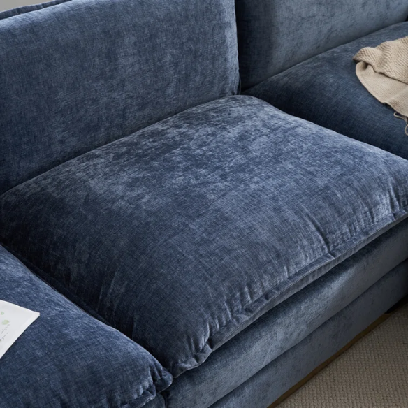 Deep blue chenille modular cloud sofa with plush foam cushions, pillow top arms, and a matching ottoman