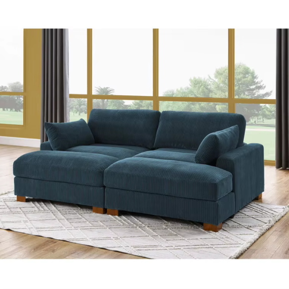 Deep blue corduroy convertible sleeper sofa with adjustable headrest, twin bed functionality, and mid-century wood legs