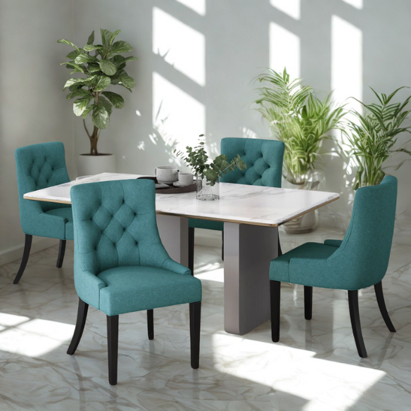 Set of four deep teal upholstered dining chairs with diamond tufted backs, armless design, sloped sides, and espresso brown wooden legs.