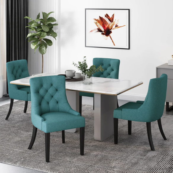 Set of four deep teal upholstered dining chairs with diamond tufted backs, armless design, sloped sides, and espresso brown wooden legs.