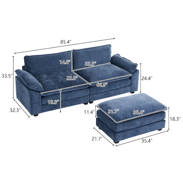 Denim blue modular cloud sofa with deep cushioned seating, curved pillow arms, and free-standing ottoman