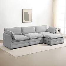 Modern 4-piece L-shaped sectional sofa in premium grey corduroy fabric. Features high-elastic sponge cushions, a sturdy metal and wood frame, and a movable ottoman for flexible configurations. Easy assembly and versatile design perfect for living rooms, bedrooms, or offices.