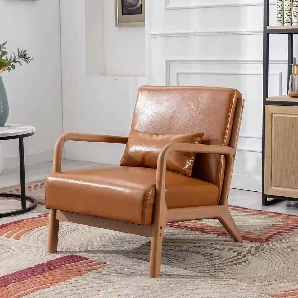 Set of two brown PU leather low-back accent chairs with high-density cushions, soft upholstery, and ergonomic design for superior lumbar support. Featuring a solid wood frame for durability and footpads for floor protection. Ideal for living rooms, bedrooms, or offices, offering both comfort and style with easy maintenance.