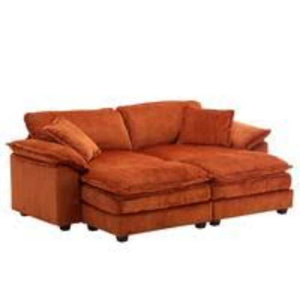 Luxurious burnt orange velvet sofa with ribbed corduroy upholstery, offering superior comfort with foam and pocket spring construction, sleek black plastic legs, and a modern design ideal for contemporary living rooms and offices.