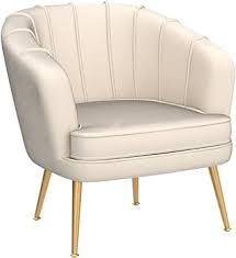 Elegant cream beige velvet shell-shaped accent chair with tufted design and gold-finished metal legs, offering comfort and modern sophistication for living rooms, bedrooms, or offices.