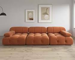 Modern burnt orange velvet sectional sofa with plush upholstery, button tufting, and durable wood frame. Versatile design with individual seat cushions for ultimate comfort, supporting up to 330 lbs per seat. Perfect for living rooms, offering easy assembly and a sleek, contemporary style.