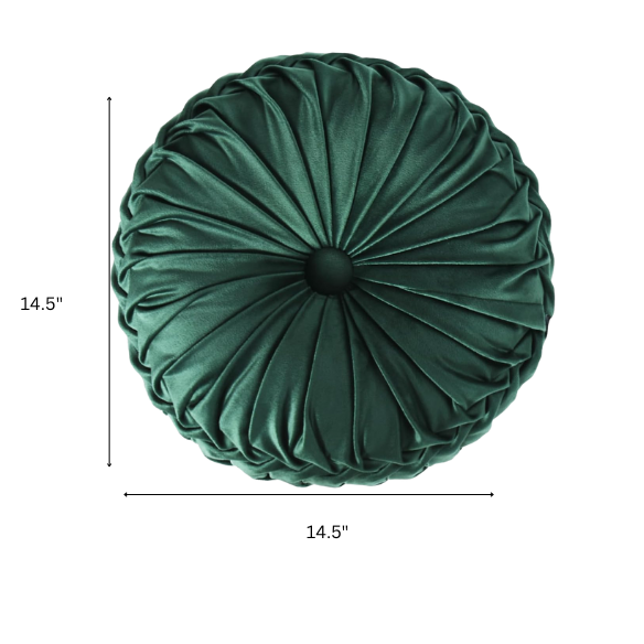Emerald green velvet round throw pillows with hand-pleated detail and central button, 14.5-inch set of two on a white sofa in a stylish living room.