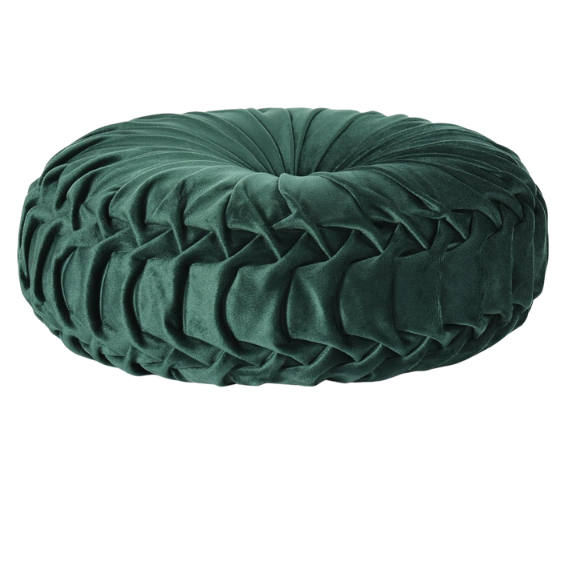 Emerald green velvet round throw pillows with hand-pleated detail and central button, 14.5-inch set of two on a white sofa in a stylish living room.