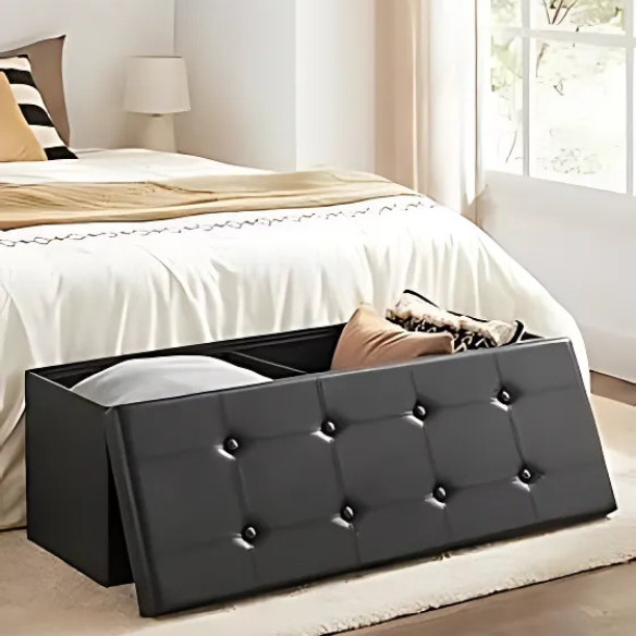 Foldable storage footrest ottoman in black faux leather with cushioned seat and ample storage space, perfect for modern living rooms.