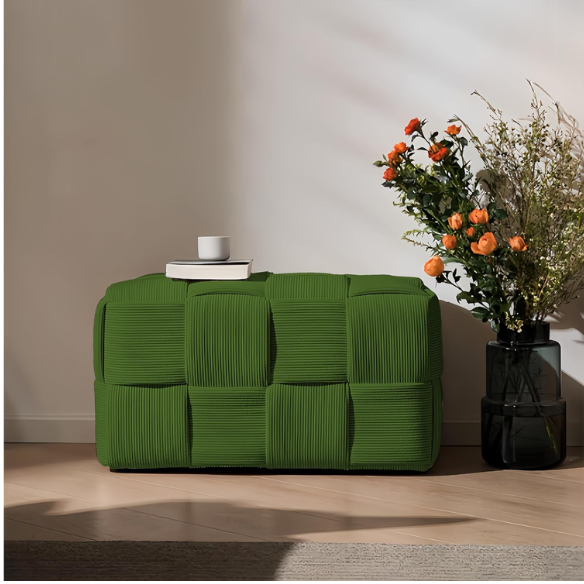 Forest green velvet ottoman with modern woven design, compact and versatile for home or office decor.